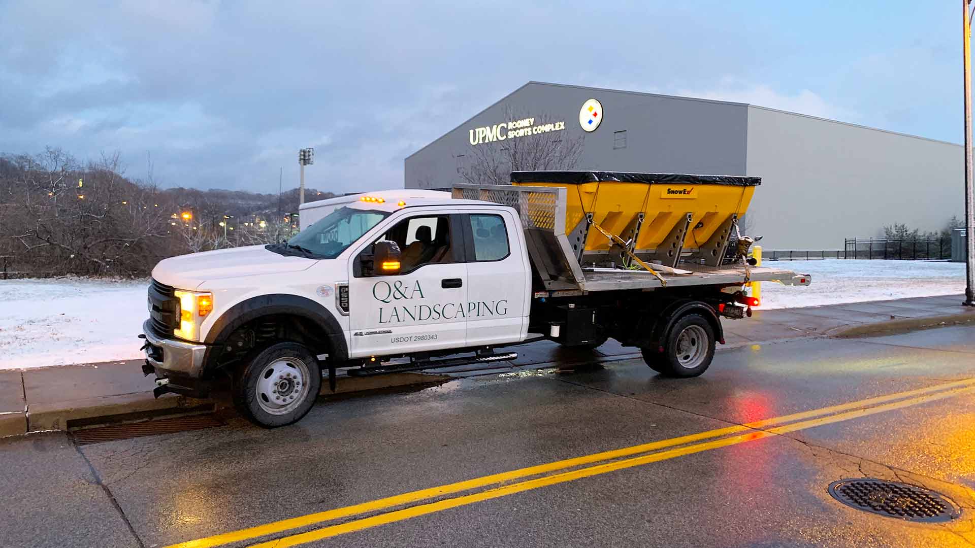 A salt truck in front of UPMC facility