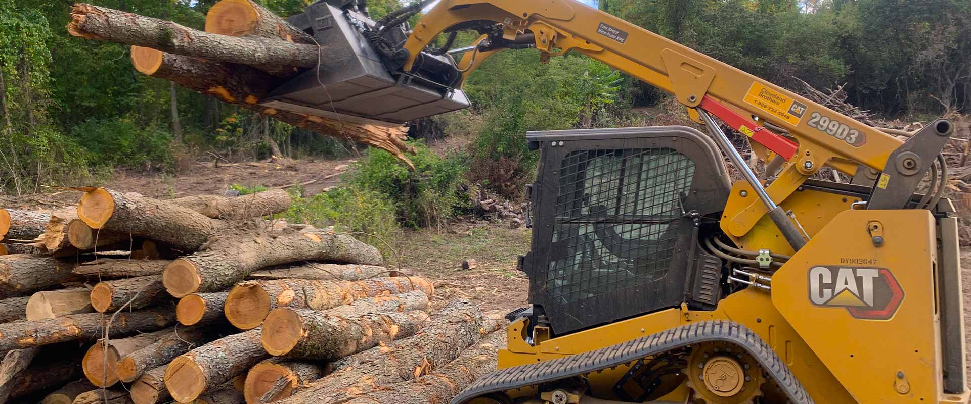 heavy machinery moves logs